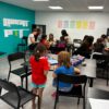 Groupe d'enfant en atelier jeux de societe au centre de vacances Neige et Soleil de Bramans
